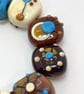 Handmade brown, ivory and turquoise patterned lamp work glass beads - Image 10