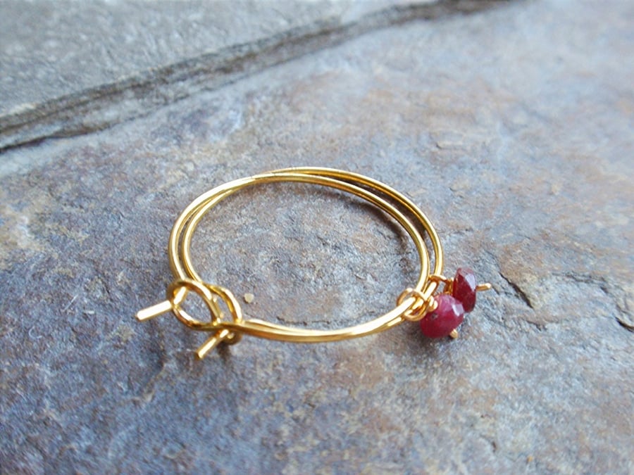 Gold plated hoop earrings with red ruby gemstones