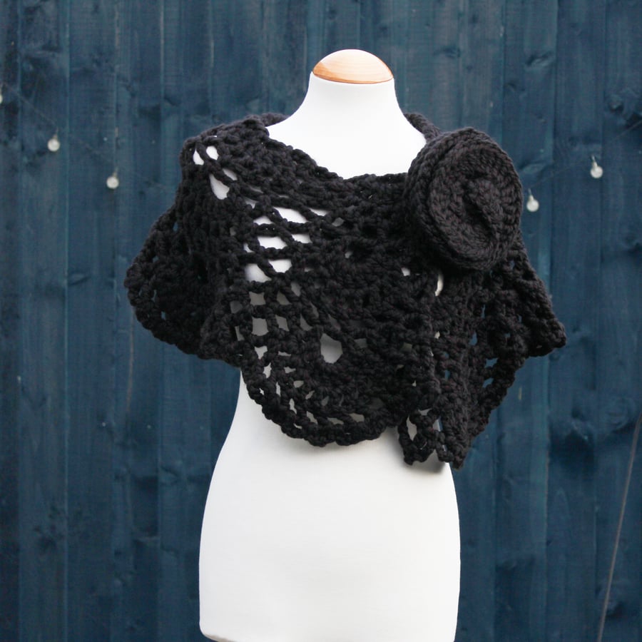 Crochet wrap in black acrylic yarn with flower brooch - design SB188