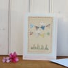 Hand-stitched mini bunting, little white doves, pretty card to keep!