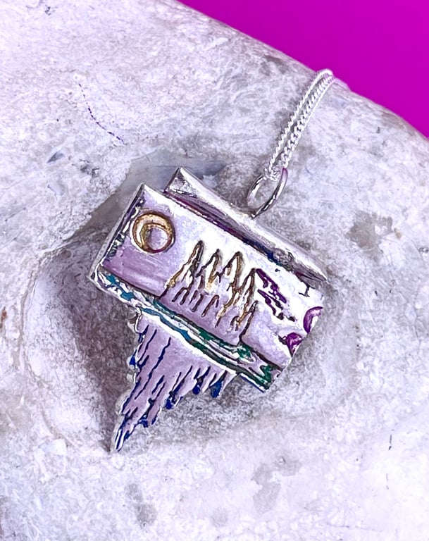 Mountain scene pendant with colour accents 