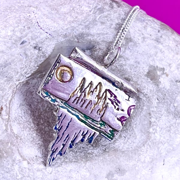 Mountain scene pendant with colour accents 