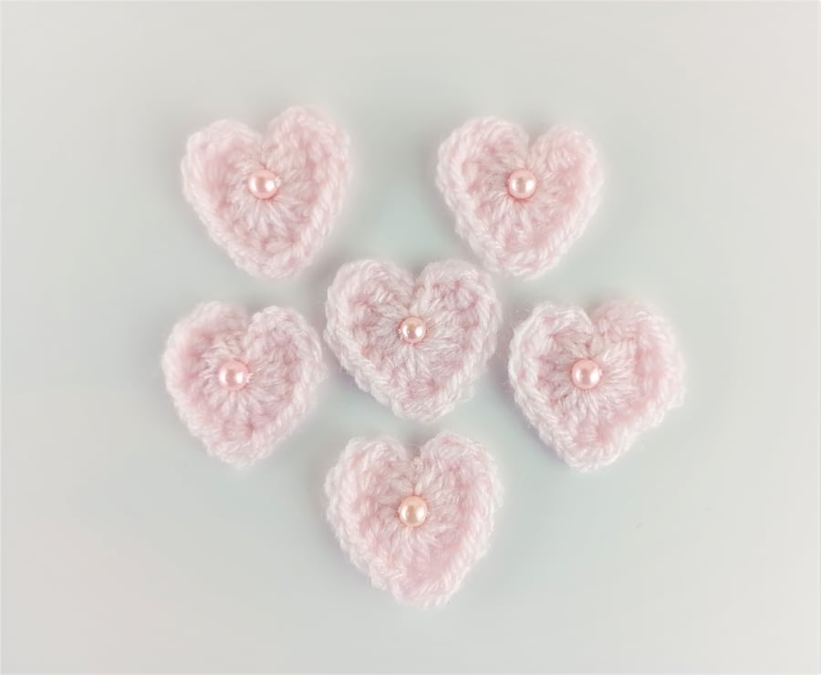 Crochet hearts - Pink heart appliques with faux pearl bead in the centre