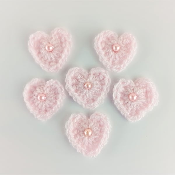 Crochet hearts - Pink heart appliques with faux pearl bead in the centre