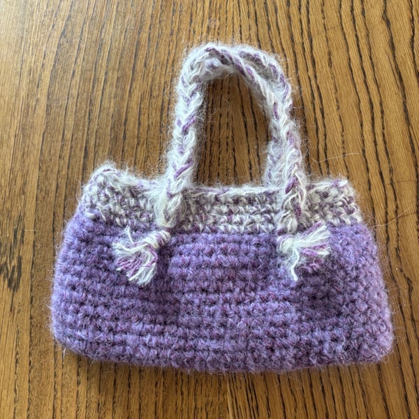 Small crochet handbag in purple and cream with cotton lining