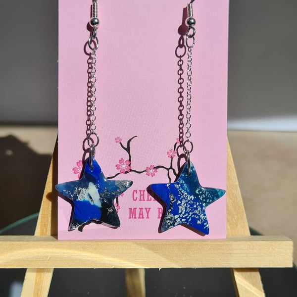 Blue marbled star shaped dangle earrings 