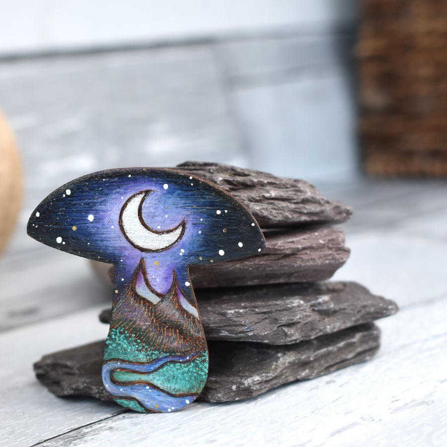 Mountains and moon Toadstool Brooch created using pyrography.