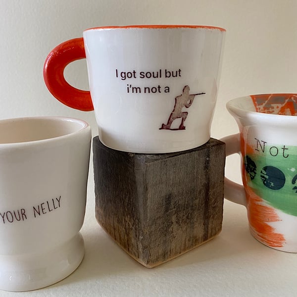 I got soul but I’m not a soldier handmade ceramic mug with orange handle.