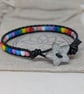 Pride flag beaded bracelet with black leather and star button - Image 1