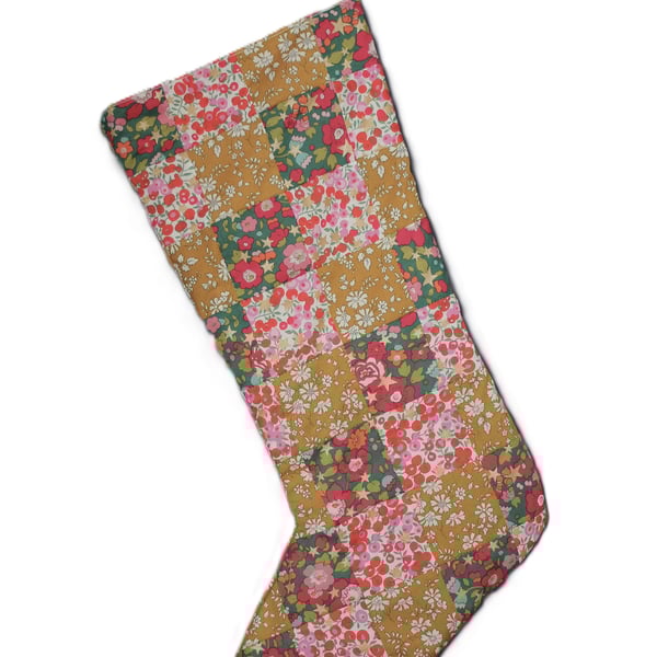 Patchwork stocking made from Liberty Tana Lawn fabric in gold, pink and greens
