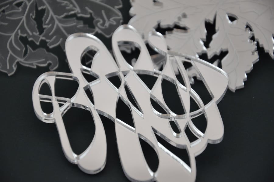 Mirrored acrylic coasters with swirl design
