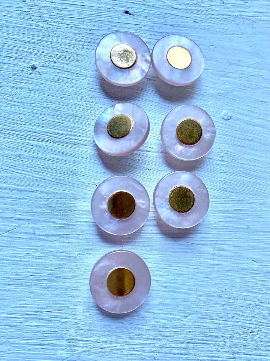 7 palest pink buttons with gold centre