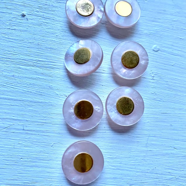 7 palest pink buttons with gold centre