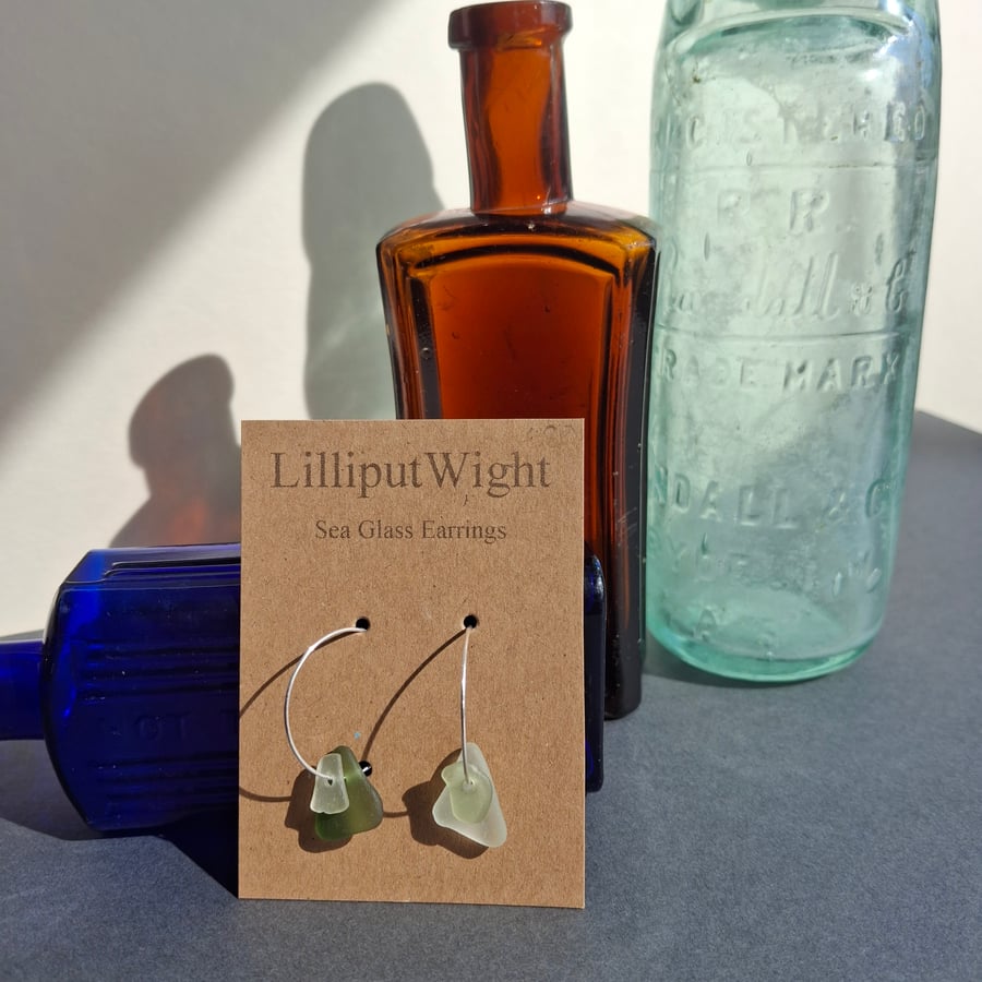 Mismatched sea foam and green coloured sea glass silver hooped earrings