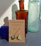 Mismatched sea foam and green coloured sea glass silver hooped earrings - Image 1