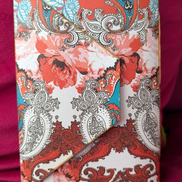 Ornate patterned notebook in orange, white and turqouise