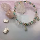 Memory wire bangle with chips of citrine, rose quartz and amazonite