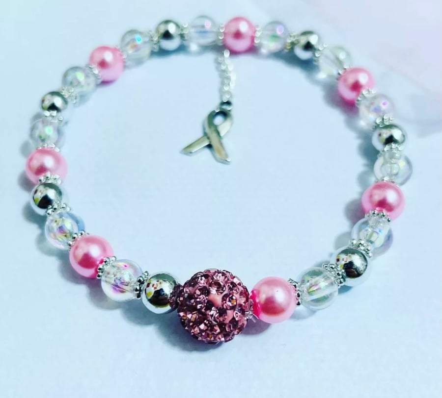 Breast cancer awareness bracelet pink beaded with Silvertone ribbon charm 
