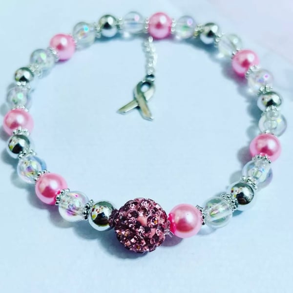 Breast cancer awareness bracelet pink beaded with Silvertone ribbon charm 