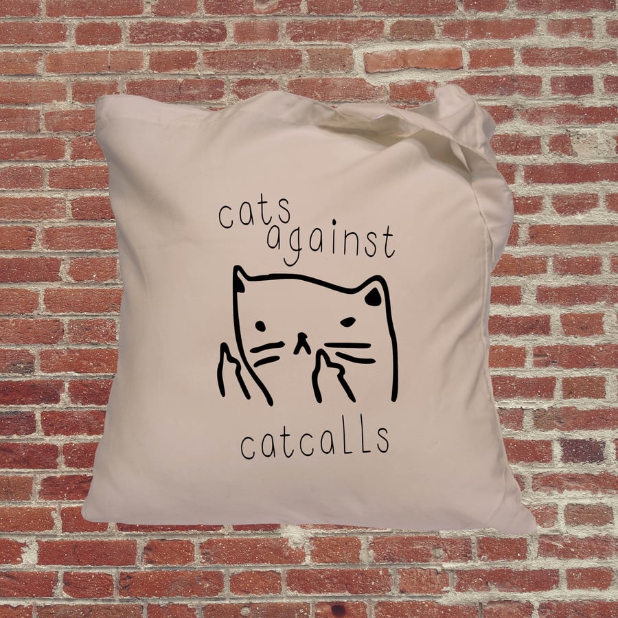 Cats against catcalls feminist tote bag. Female empowerment