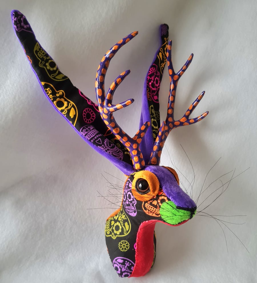 Faux jackalope head wall mount in Day of the Dead skull style fabric