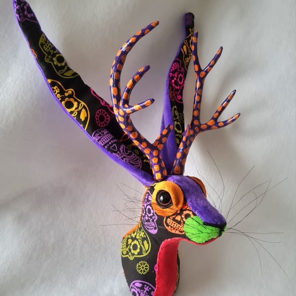 Faux jackalope head wall mount in Day of the Dead skull style fabric
