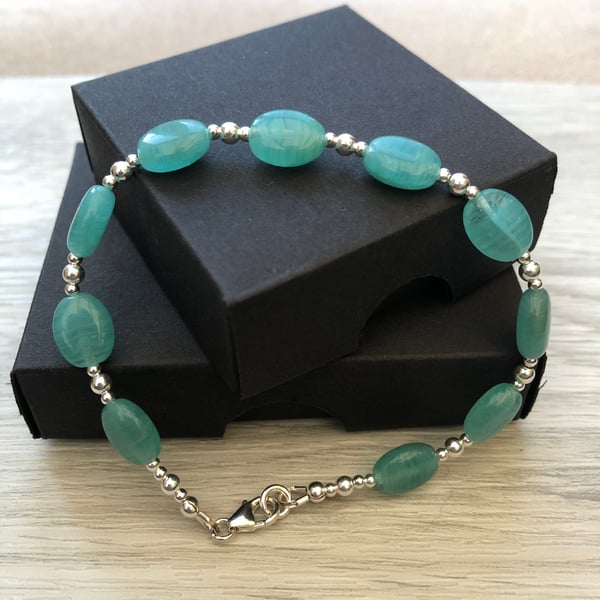 Green blue Czech glass and sterling silver bracelet.