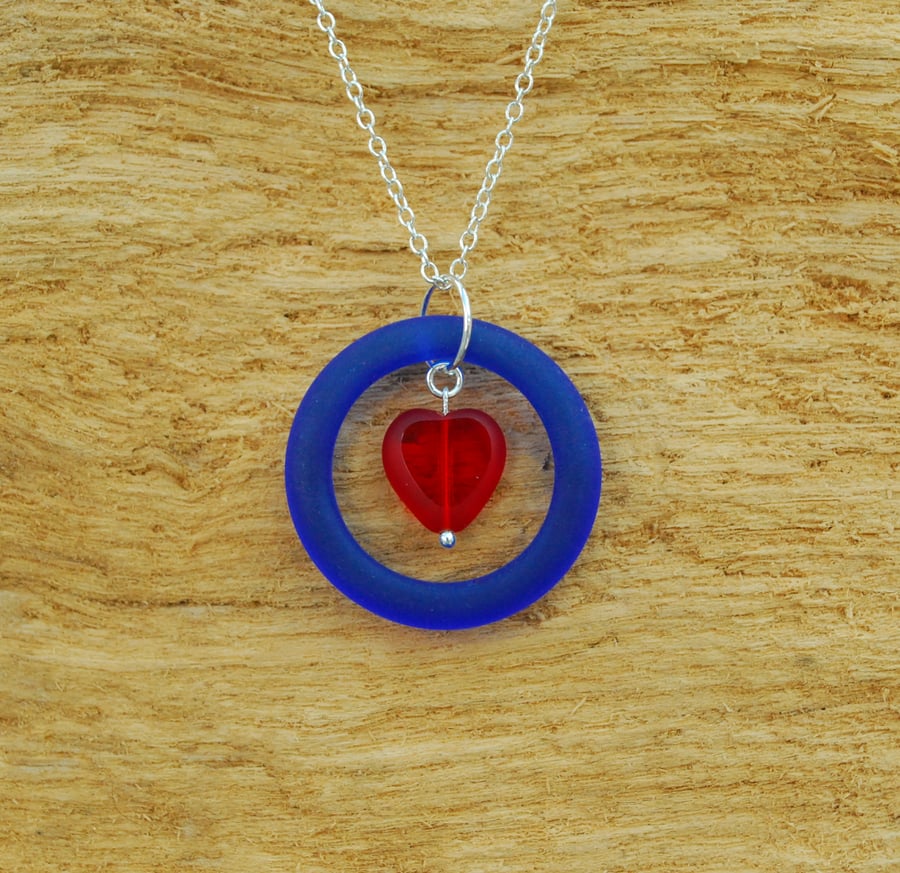 Blue ring pendant with red heart