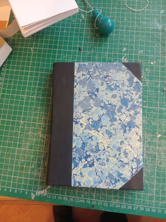 A5 Journal with tree free hemp paper, printed marbled cover and leather spine