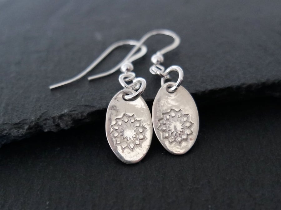 Oval silver earrings with a flower pattern pure silver clay sterling silver