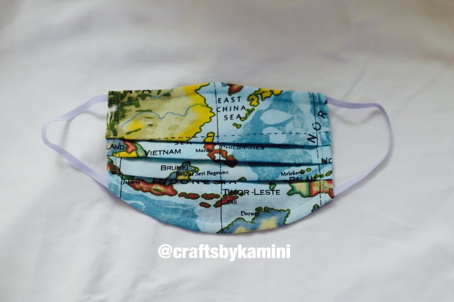 Washable face covering with nose wire and filter pocket