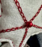 A Red and white star tree decorations with metallic thread and seed beads  - Image 6