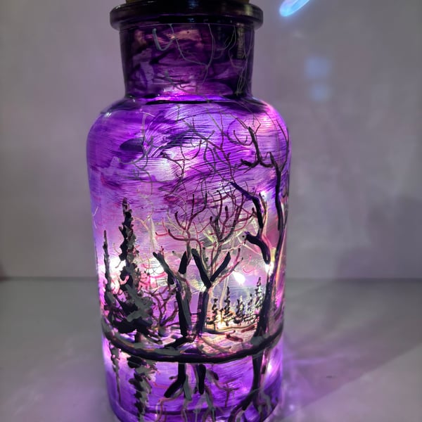 A hand painted and fired glass vase with lid by Andrew Jenkins 