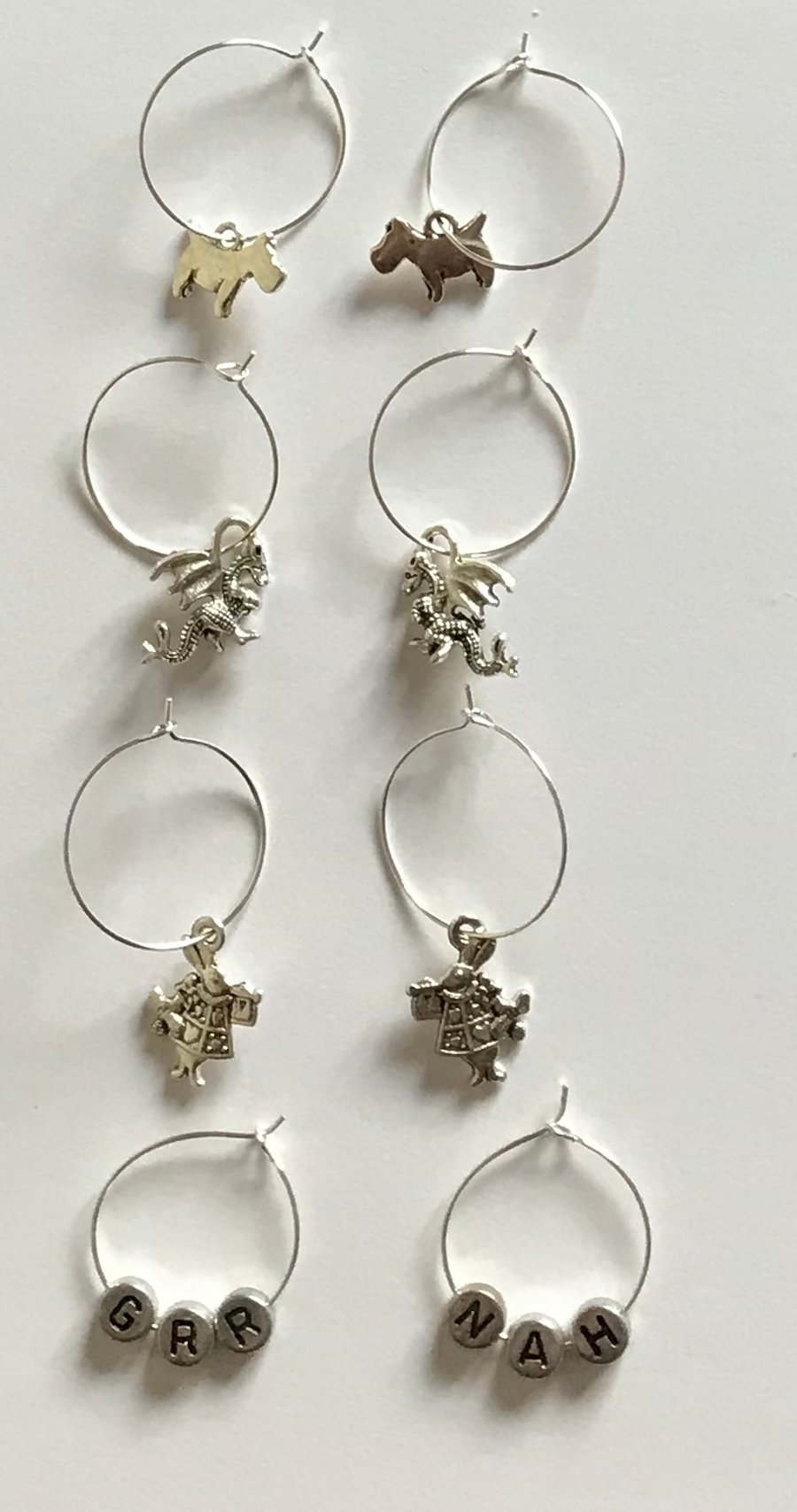 Stunning silver set of 4 hoop charmed earrings
