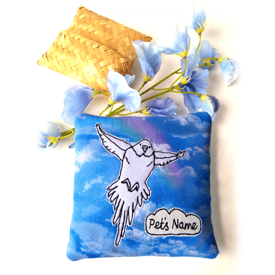 Small pet memorial pouch – Flying bird image against blue sky with rainbows