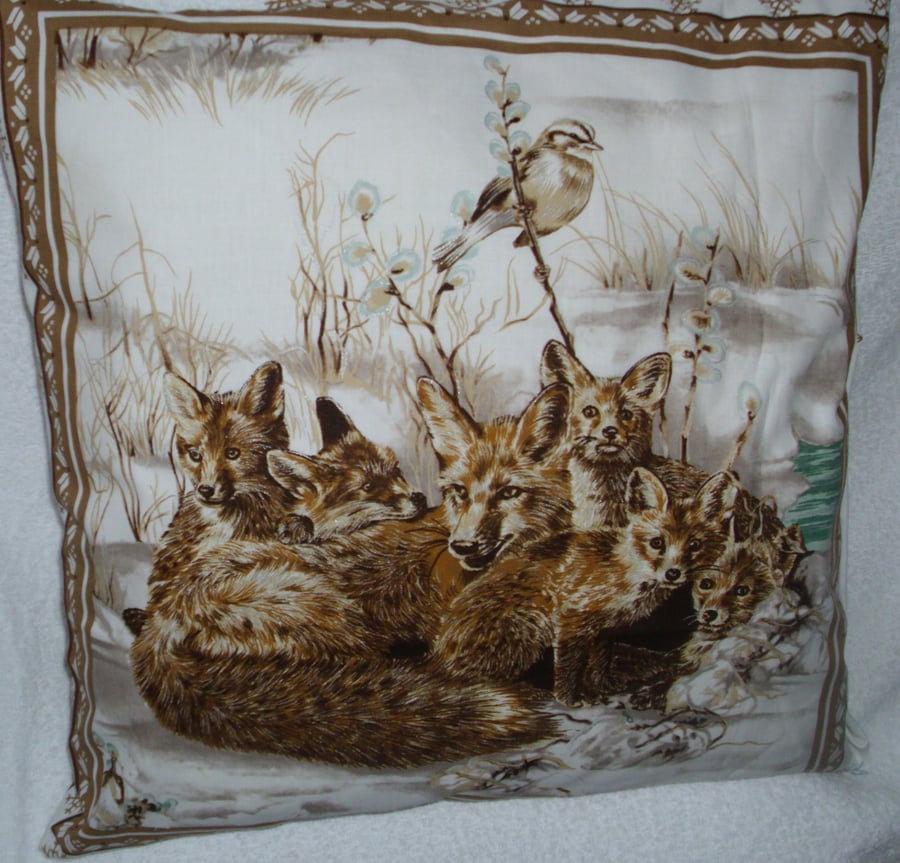 Vixen and her five cubs curled up in the snow Winter cushion