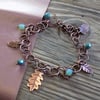 Aged rustic copper 'leaves and feather' charm bracelet 