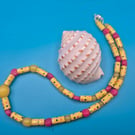 Necklace made with dotted Yellow and pink recycled paper