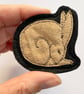 Upcycled sleeping hare brooch pin or badge.  - Image 1