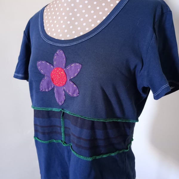 Black patchwork tee with flower applique