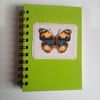 Hand stitched cross stitch butterfly notebook.