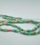 Long handmade aqua summer swirl paper bead necklace