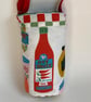 Water bottle carrier with pocket for phone. Sauce and tomatoes