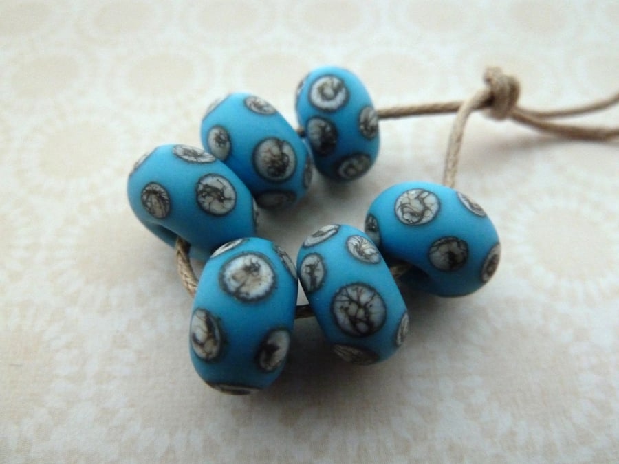 handmade lampwork glass beads, blue and ivory spots