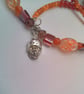 Silver Skull Pendant on an Orange Red Purple & Pink Shell Beaded Necklace - Image 7