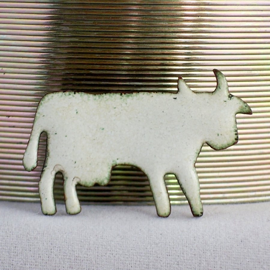 white cow brooch