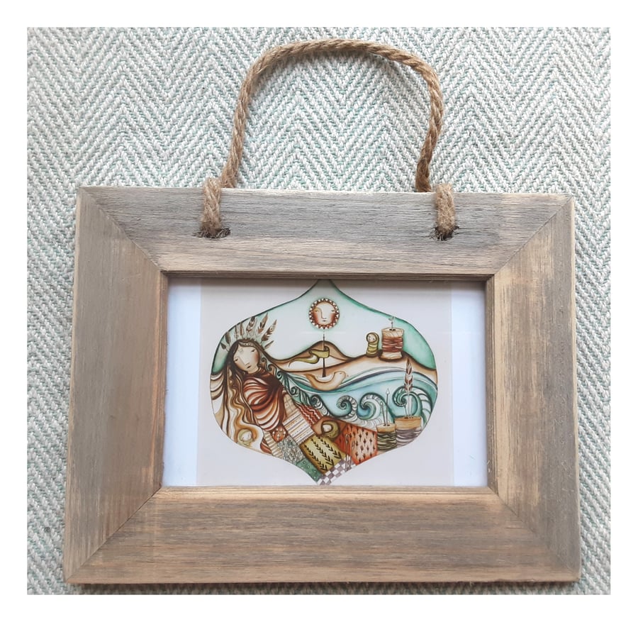 Unravel small print in driftwood frame