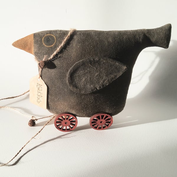 Primitive pull toy Blackbird on Wheels