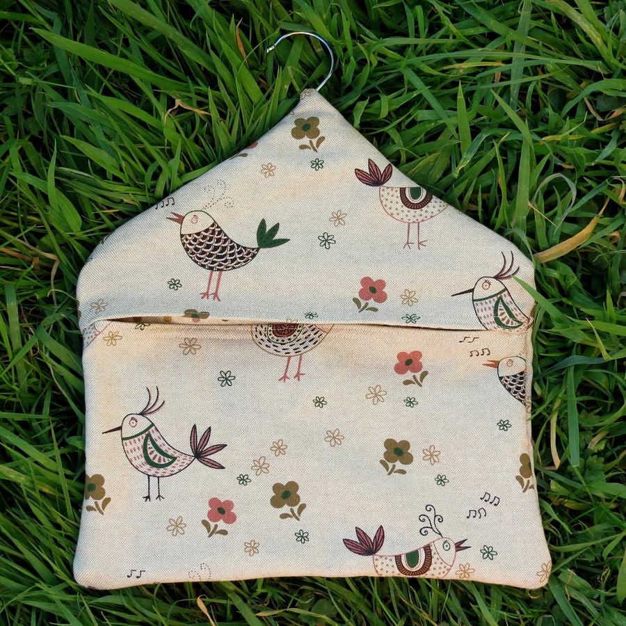 A peg bag with a quirky chickens design.  Peg storage.