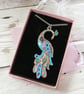 Sky blue peacock pendant with rose gold, turquoise and purple accents - Image 3